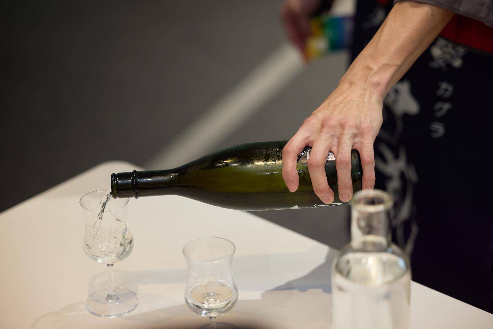 Pouring sake into tasting glasses